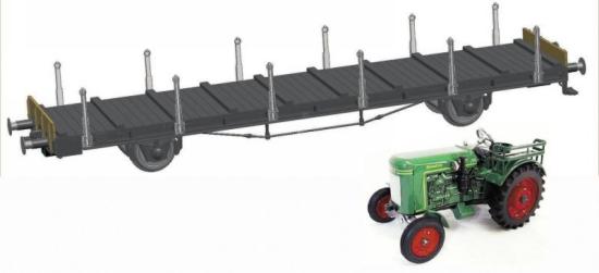 Flat car loaded with tracktor<br /><a href='images/pictures/Fleischmann/523601.jpg' target='_blank'>Full size image</a>